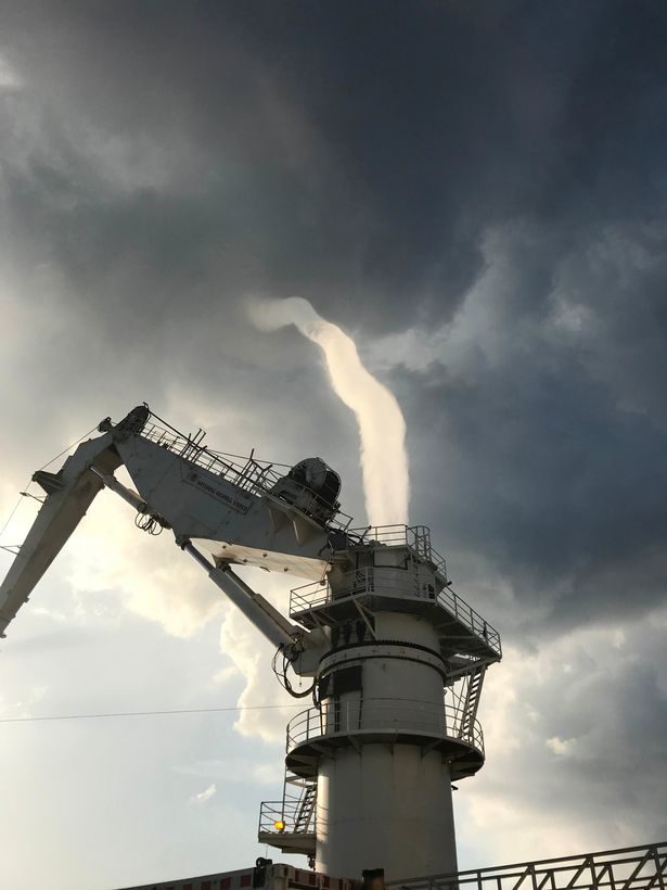 The footage of the tornado swirling above the sea was captured in dramatic footage by two brave sailors