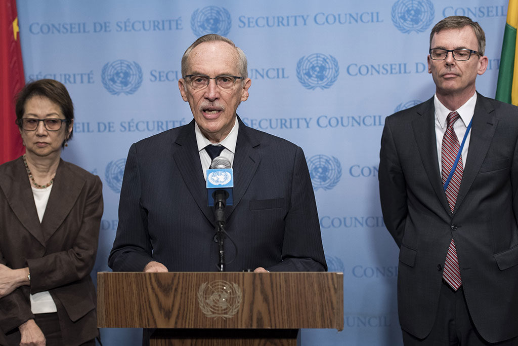 Click to enlarge The UN's Edmond Mulet and the children he