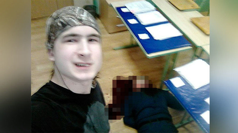 Click to enlarge Moscow student posts selfie of himself standing over slain teacher's corpse