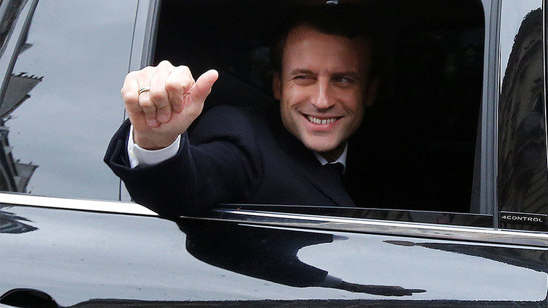 Macron thumbs up wink