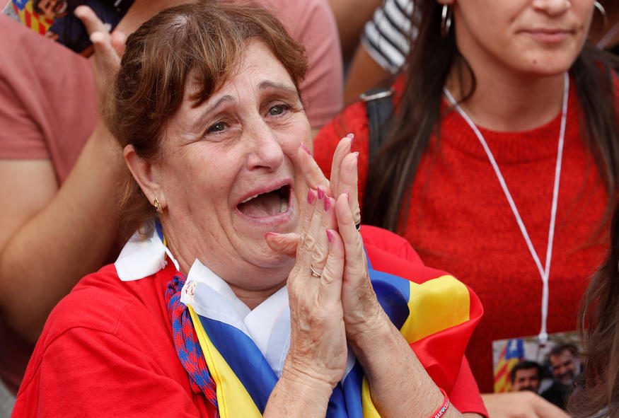 Click to enlarge A woman reacts while the Catalan regional parliament votes for independence of Catalonia from Spain in Barcelona