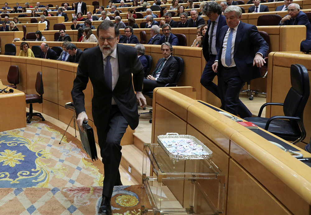 Spain's Prime Minister Mariano Rajoy leaves his seat during a debate at the upper house Senate in Madrid, Spain, October 27, 2017