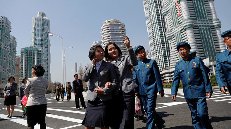 North Koreans walking at the street