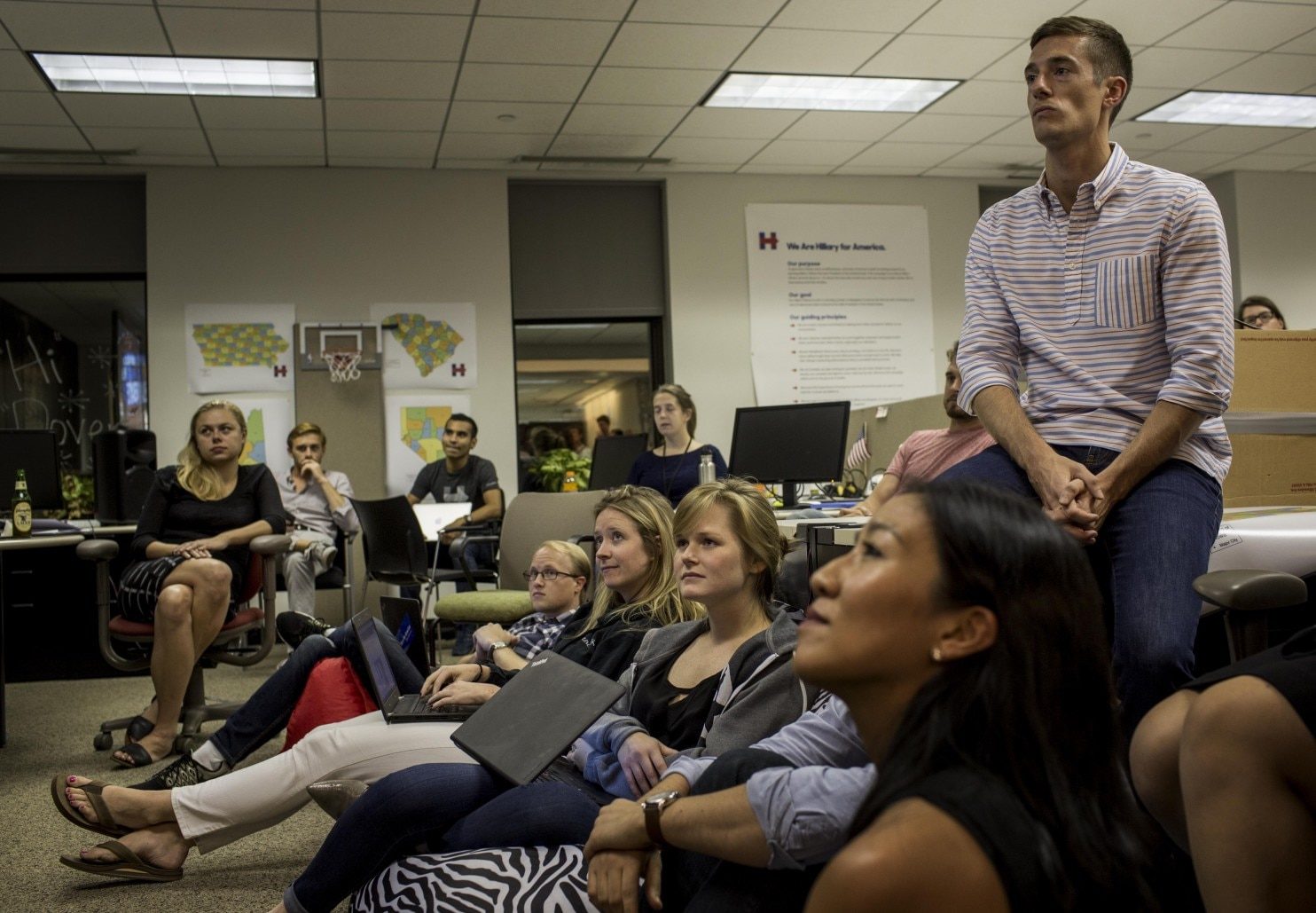 Click to enlarge Staffers at Hillary Clinton headquarters in Brooklyn watch a GOP debate on Sept. 16, 2015.