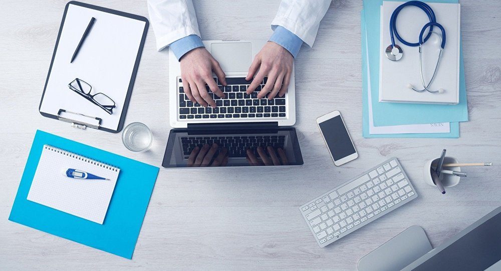 Click to enlarge doctor on laptop