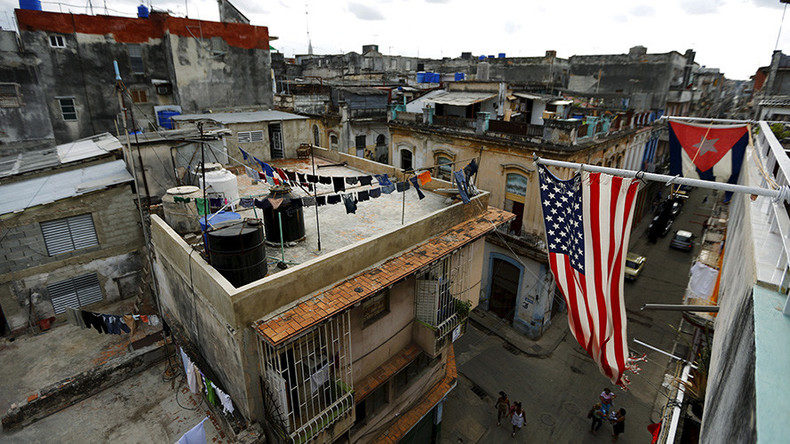 U.S. and Cuban flags are seen on a balcony in Havana, Cuba