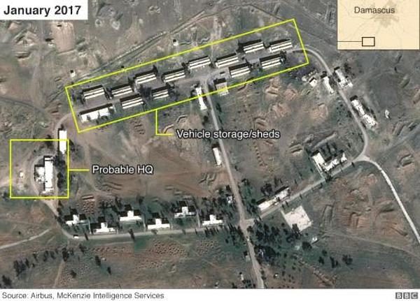 Satellite images shows a series of two dozen large low-rise buildings