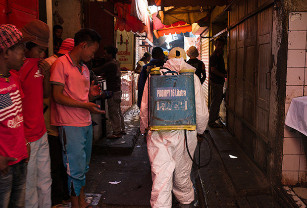 Click to enlarge OUTBREAK: Health officials battle the plague in Madagascar in hazmat suits