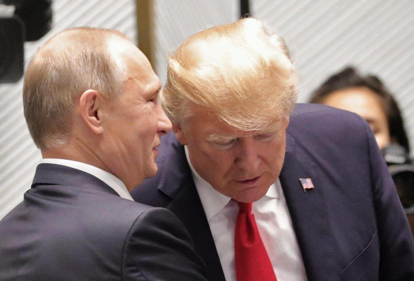 Click to enlarge Vladimir Putin and Donald Trump talk at the start of a leader's meeting at the Asia-Pacific Economic Cooperation summit in Danang EPA
