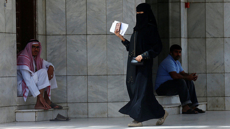 Women wearing burka as she walks through the street