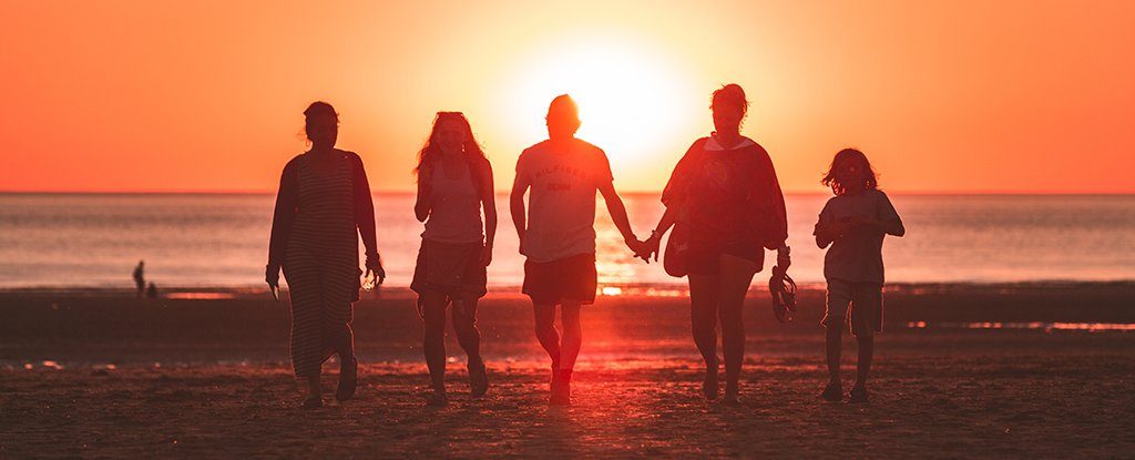 Friends walking on a beach