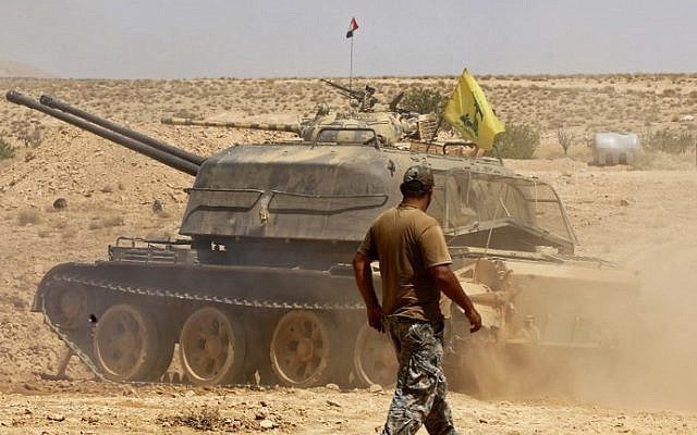 Click to enlarge A tank flying the Hezbollah terror group's flag is seen in the Qara area in Syria's Qalamoun region on August 28, 2017.