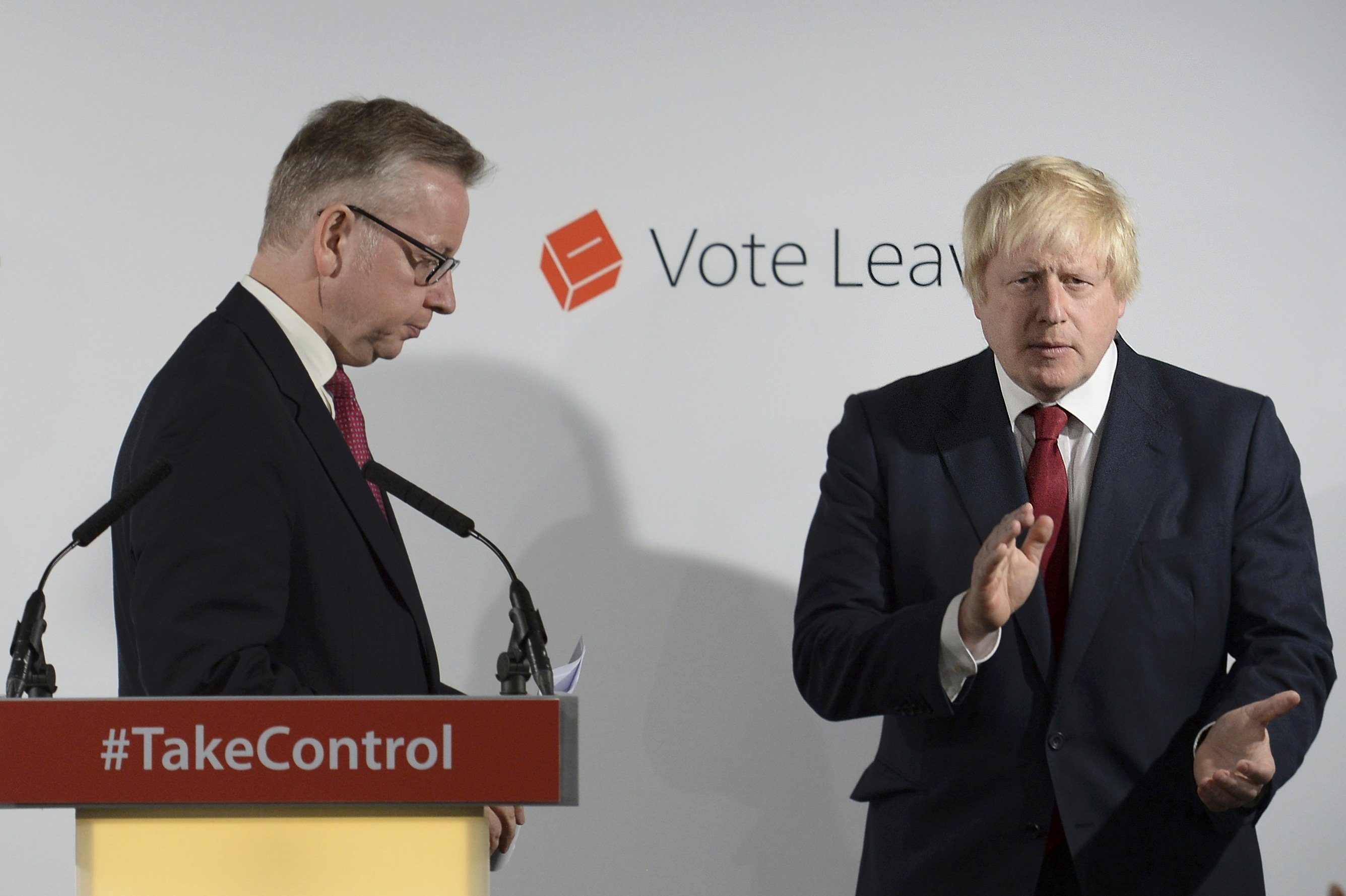 Britain's Justice Secretary Michael Gove (L) finishes speaking as Vote Leave campaign leader Boris Johnson applauds at the group's headquarters in London, Britain June 24, 2016.