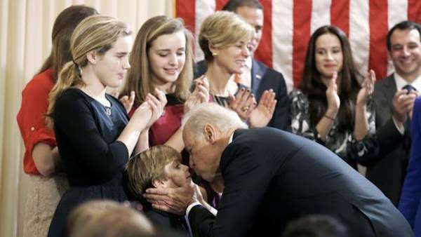 Biden kissing child