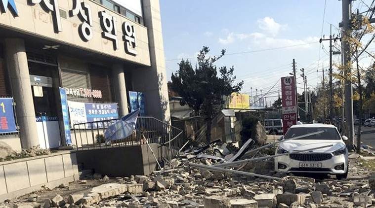 Debris from a collapsed wall is scattered in front of a shop after an earthquake in Pohang, South Korea.