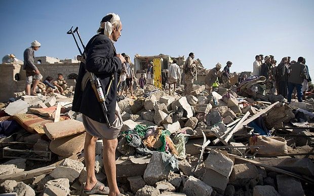Click to enlarge People search for survivors under the rubble of houses destroyed by Saudi airstrikes in Sanaa, Yemen Photo: AP