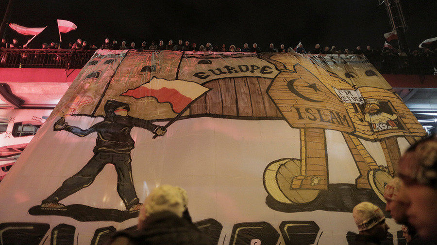 Click to enlarge Protesters hold an anti-refugee banner during a rally in Warsaw, November 11, 2017 Agata Grzybowska / Reuters
