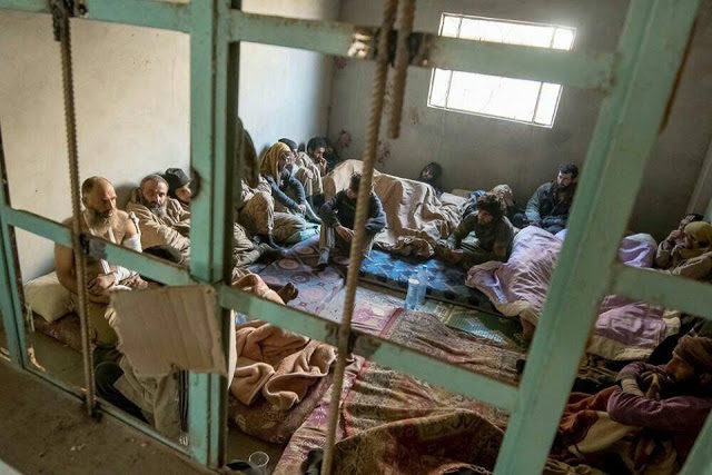 Captured ISIS fighters in a cell