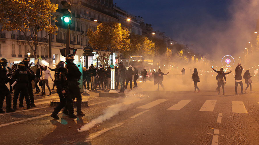 Click to enlarge French police use tear gas to disperse protest against slave auctions in Libya (VIDEO) Demonstrators taking part in a march against