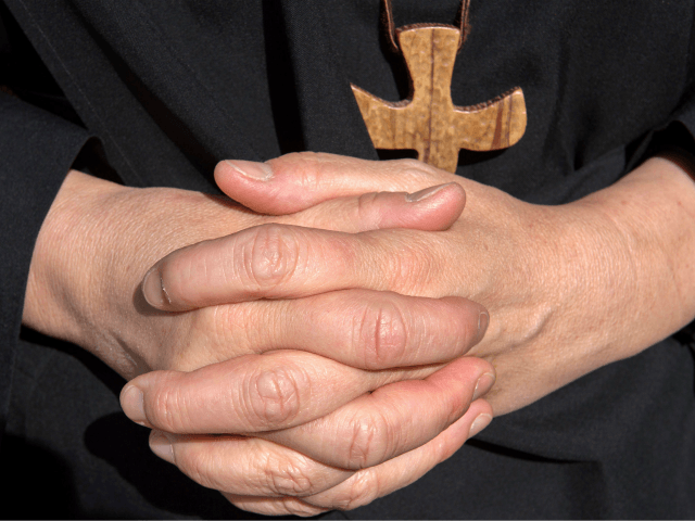 nun with cross