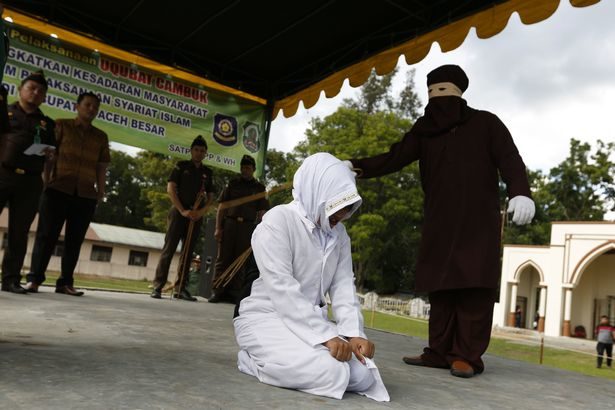 Click to enlarge woman getting caned sharia law 2