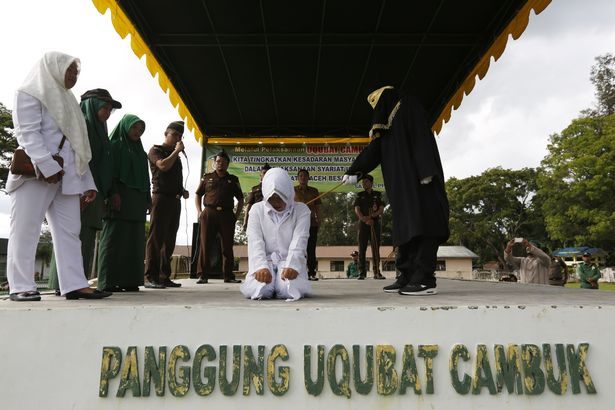 Click to enlarge woman getting caned sharia law 3