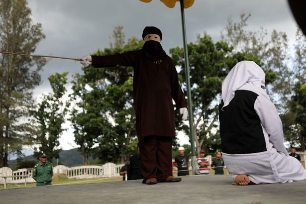 Click to enlarge woman getting caned sharia law 6