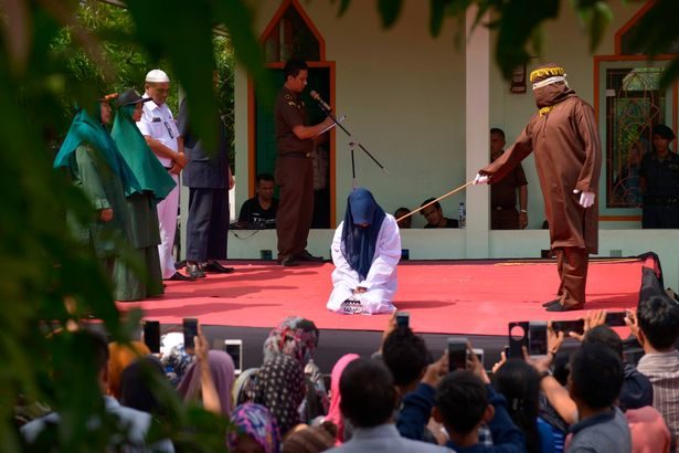 Click to enlarge woman getting caned sharia law 7