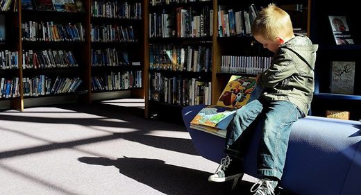 child reading book