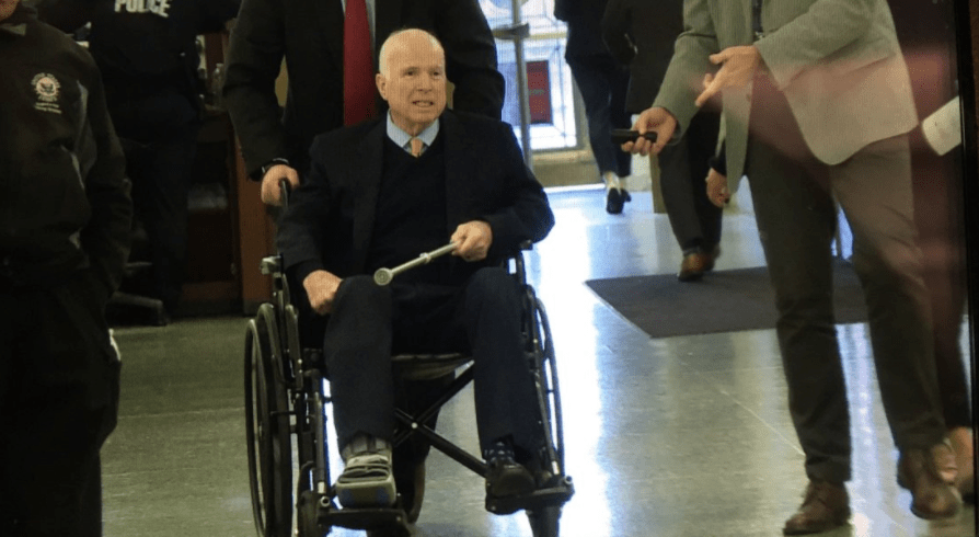 John McCain in wheelchair