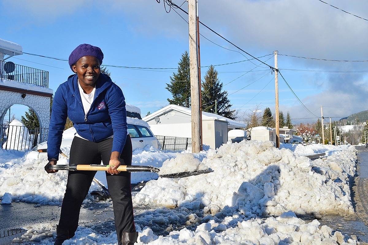 Linda Maz shovels out her driveway on Sparks Ave. after the 57cm snowfall on the weekend.