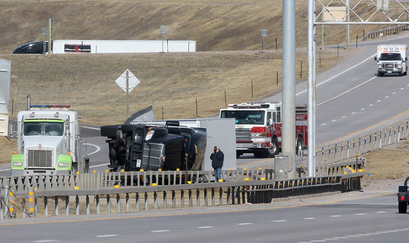 Click to enlarge toppled trucks Wyoming
