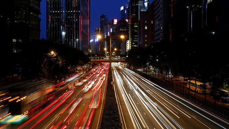 Click to enlarge Russia-China oil deal motorway Traffic is seen between office buildings at sunset in downtown Hong Kong, China Bobby Yip / Reuters