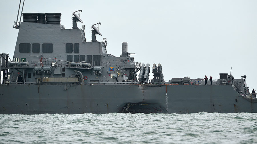 USS John S. McCain with a hole on its left portside