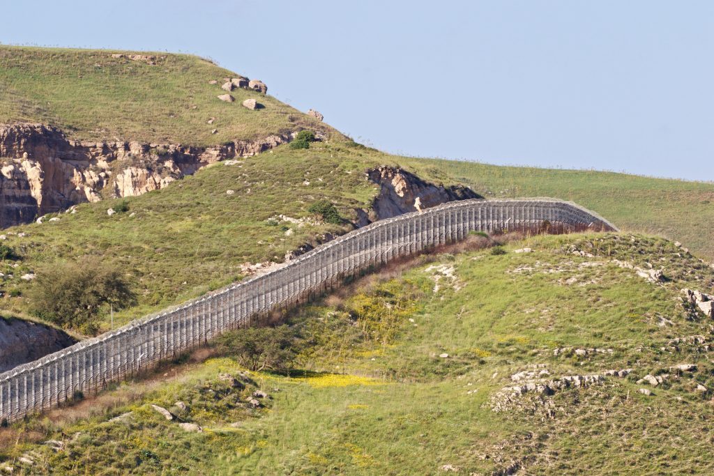Click to enlarge View of the fence separating northern Israel from Syria and Jordan, in the Golan Heights.