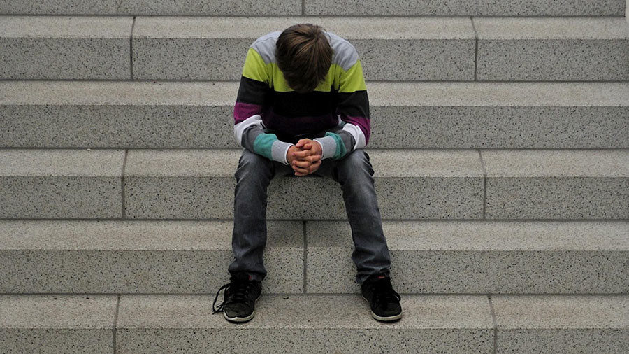 kid sitting on stairs