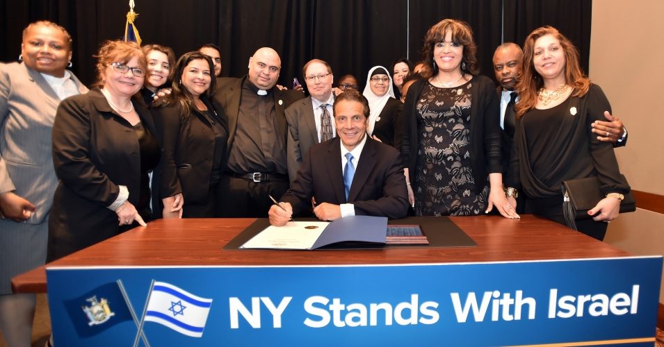 Click to enlarge Governor Andrew M. Cuomo signs a first-in-the-nation Executive Order directing the divestment of public funds supporting the Boycott, Divestment and Sanctions (BDS) campaign against Israel during a breakfast meeting at the Harvard Club.