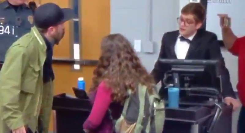 Click to enlarge reporter arrested grabs woman UConn