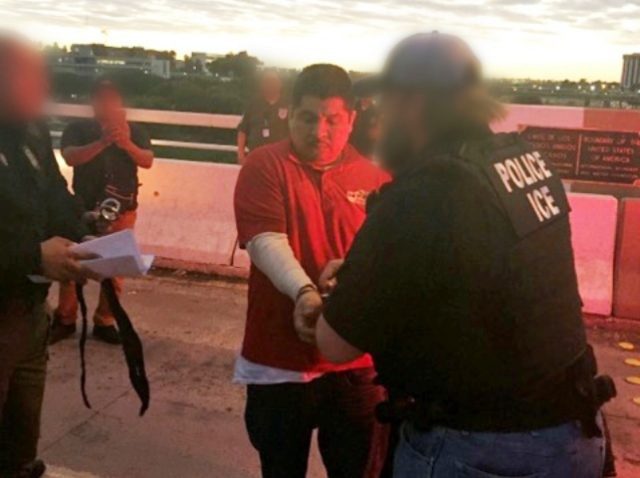 Click to enlarge ICE agents arrest man