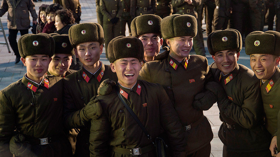 Click to enlarge North Korean soldiers celebrating