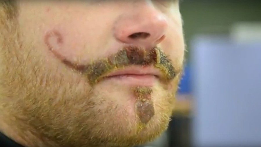 man with tattooed moustache