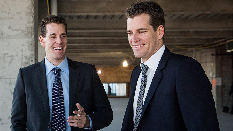 Cameron Winklevoss (L) and his brother Tyler Winklevoss