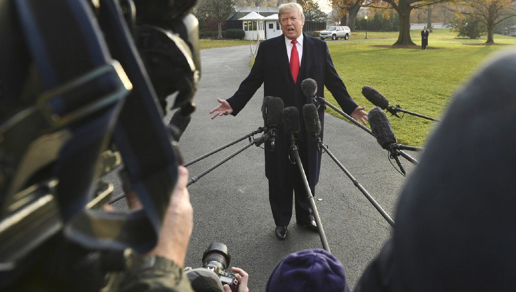 Click to enlarge Trump talking to press