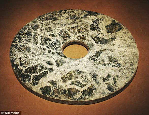 Click to enlarge The Liangzhu society, a mysterious Neolithic group known for its stunning jade artefacts. The artefacts, such as the Liangzhu jade ring pictured (file photo), were buried with members of nobility