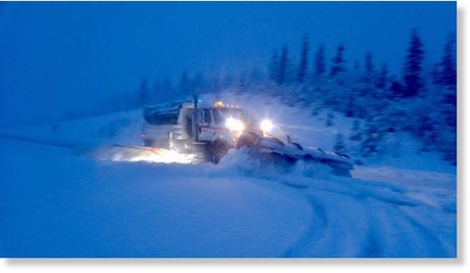 Click to enlarge Snowplows clearing the Richardson Highway near Thompson Pass, Alaska.