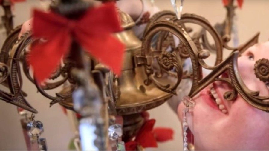 Click to enlarge Amanda Liberty with her beloved chandelier.