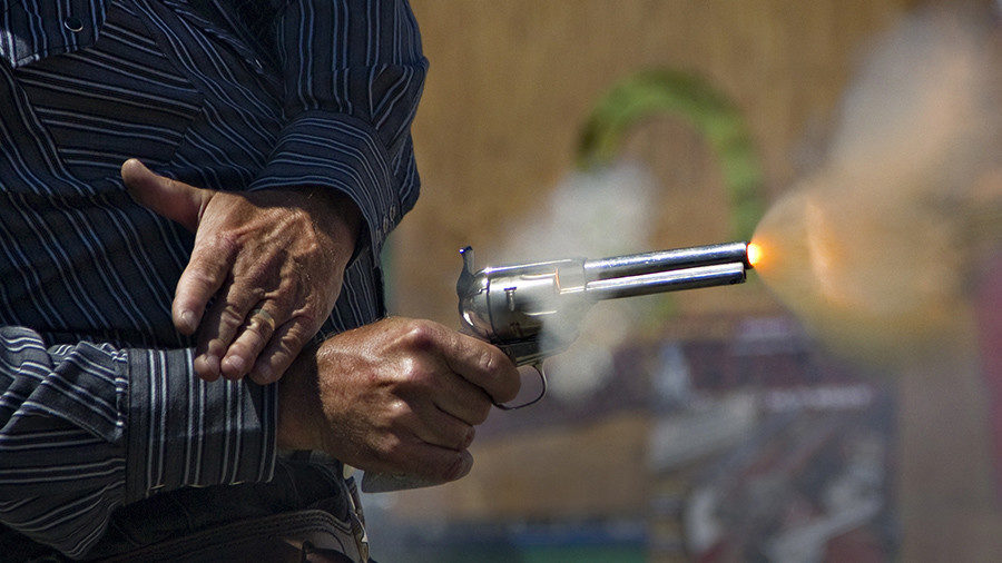 Man firing gun