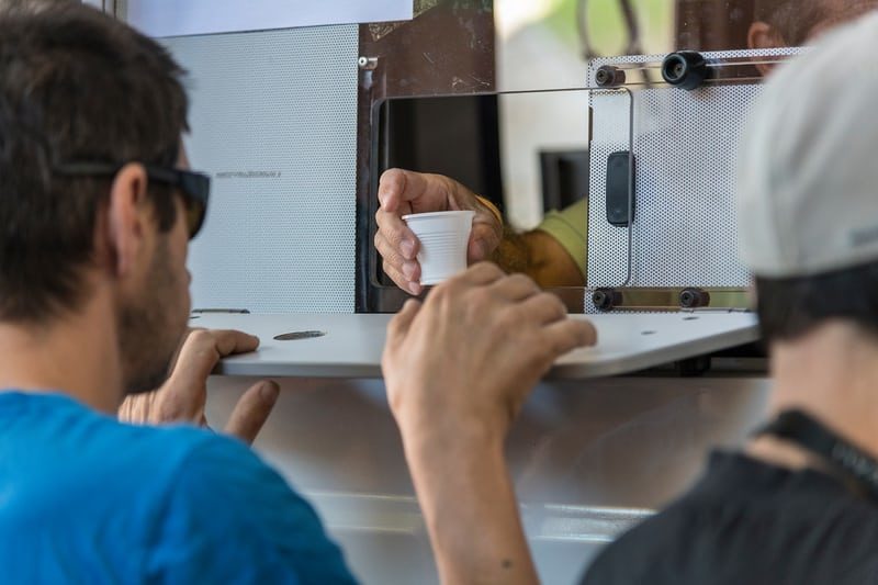 Click to enlarge A nurse hands out methadone to addicts in Lisbon.