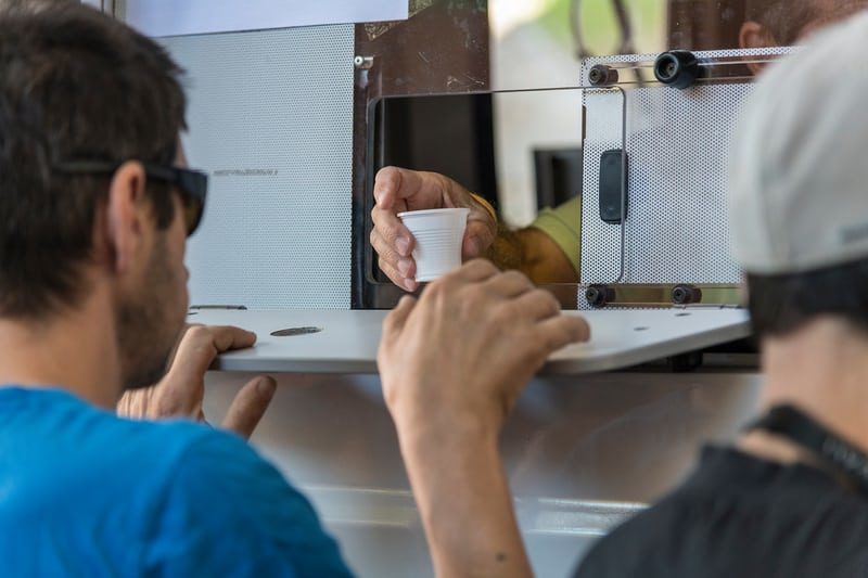 A nurse hands out methadone to addicts in Lisbon.