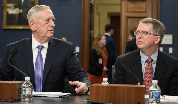 Click to enlarge Jim Mattis speaks with DoD Comptroller David L. Norquist